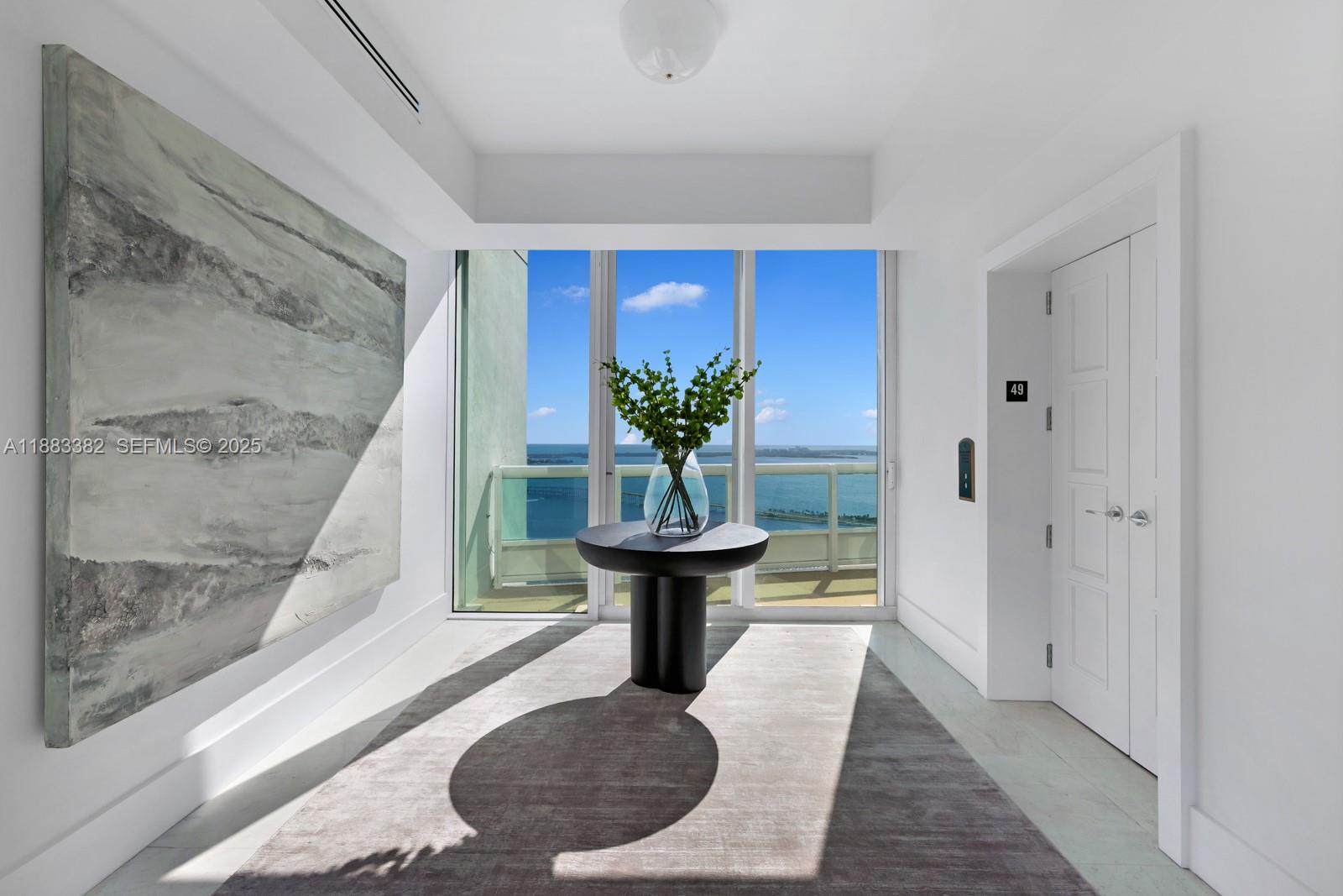 1643 Brickell Avenue, Unit PH4902 Miami, FL 33129 - Photo 34 of 38 a view of a living room with a potted plant