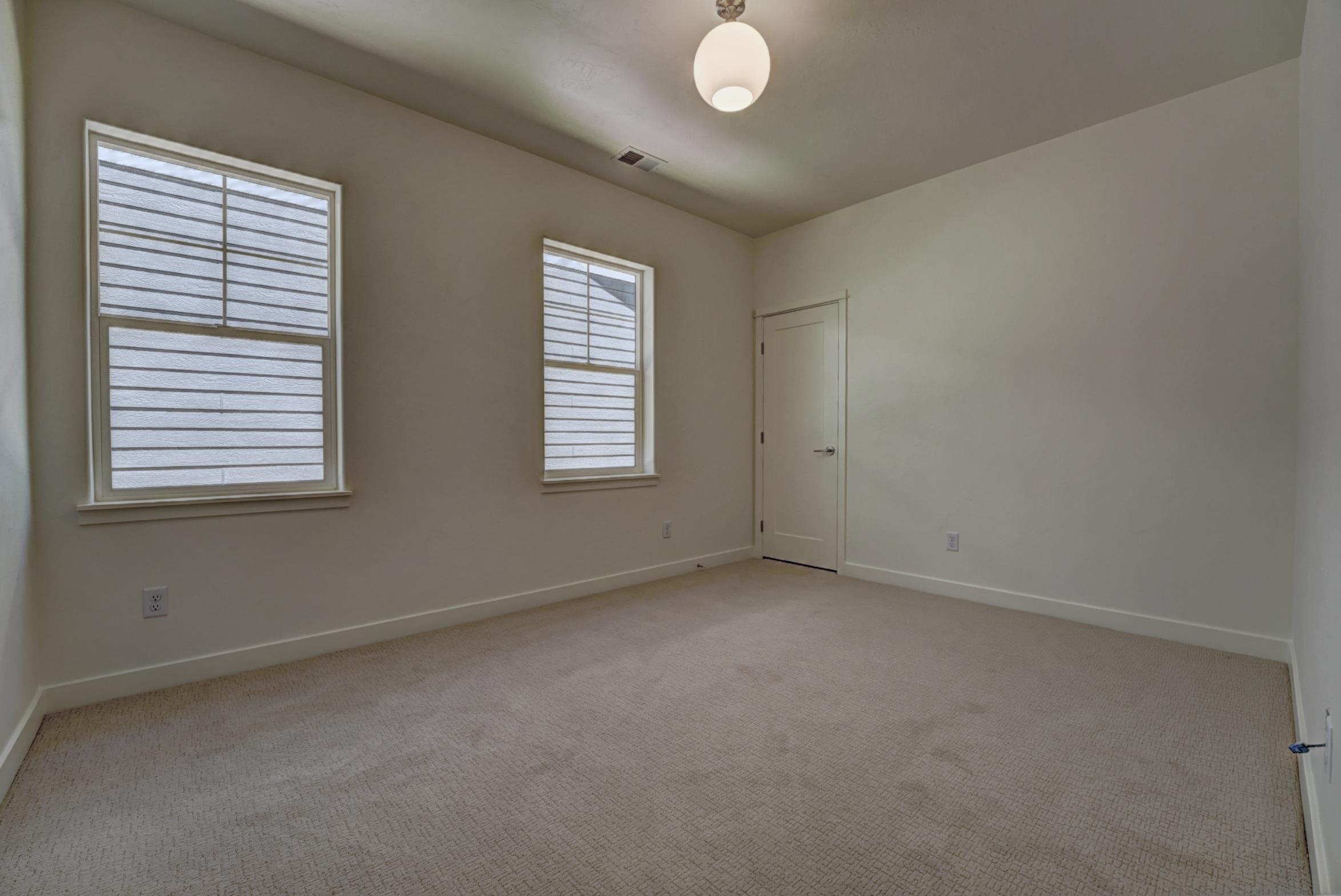 1986 Tomochic Drive Fruita, CO 81521 - Photo 17 of 35 an empty room with windows