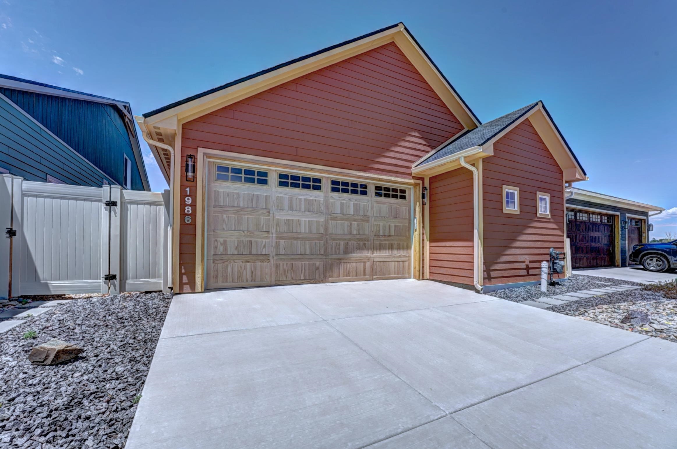 1986 Tomochic Drive Fruita, CO 81521 - Photo 23 of 35 a front view of a house with a yard and garage