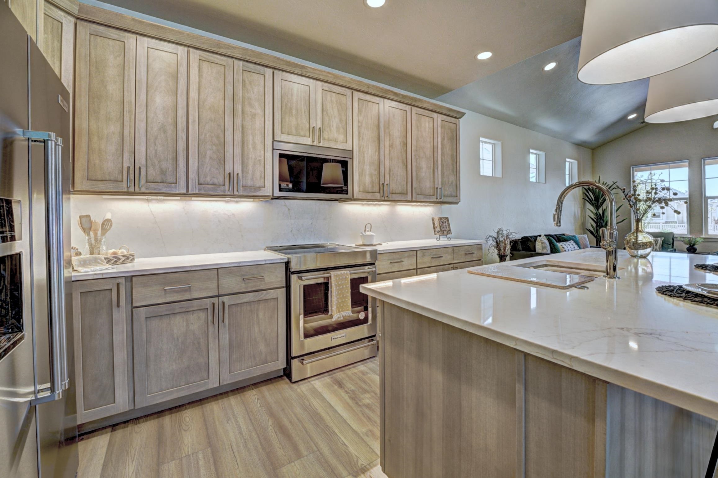 1986 Tomochic Drive Fruita, CO 81521 - Photo 9 of 35 a kitchen with stainless steel appliances granite countertop a sink a stove and a microwave