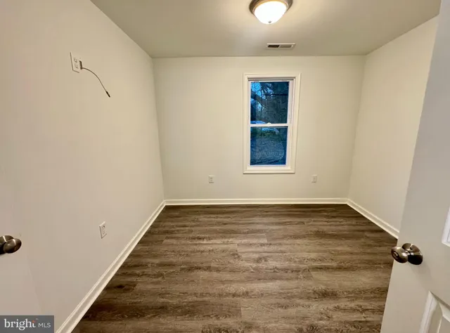 a bathroom with a toilet a sink and bathtub