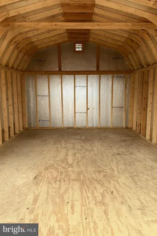 a view of a livingroom with furniture and windows