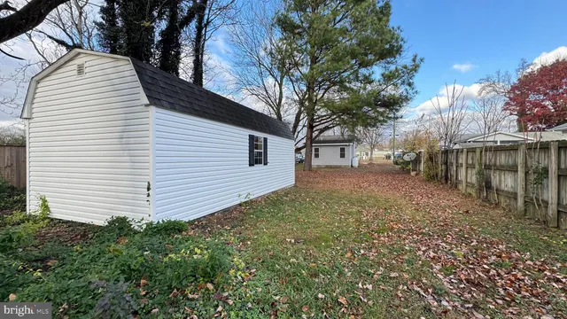 a house that has a tree in front of the house