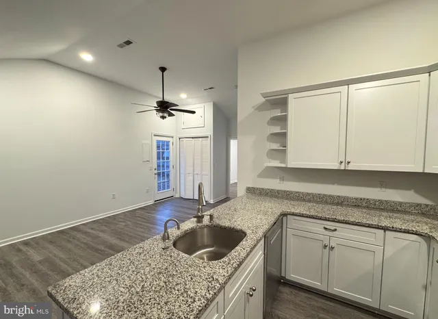 a kitchen with a sink and cabinets