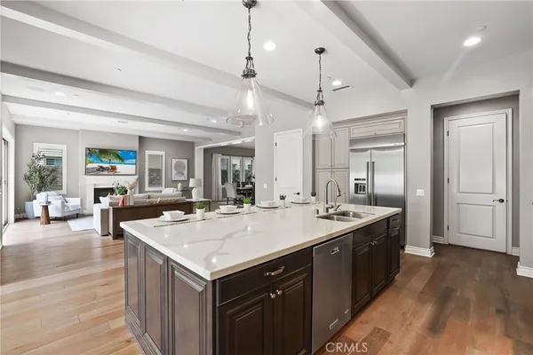 a kitchen with cabinets and steel stainless steel appliances