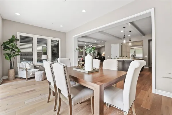 a view of a dining room with furniture and wooden floor
