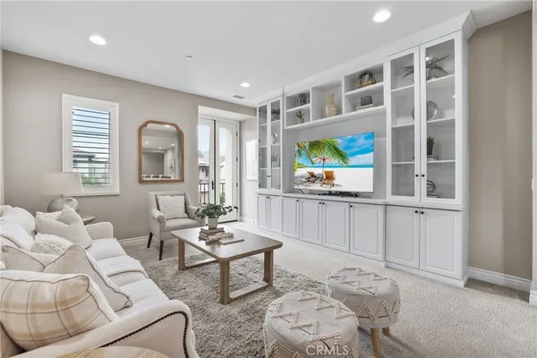 a spacious bedroom with a bed and a couch