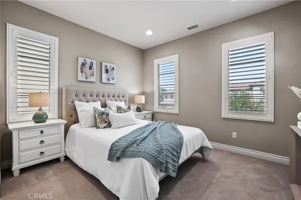 a utility room with stainless steel appliances granite countertop a sink and a washer dryer