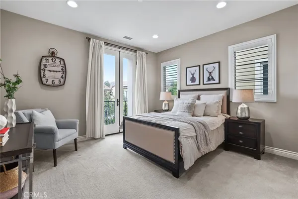 a bedroom with a large bed and a window