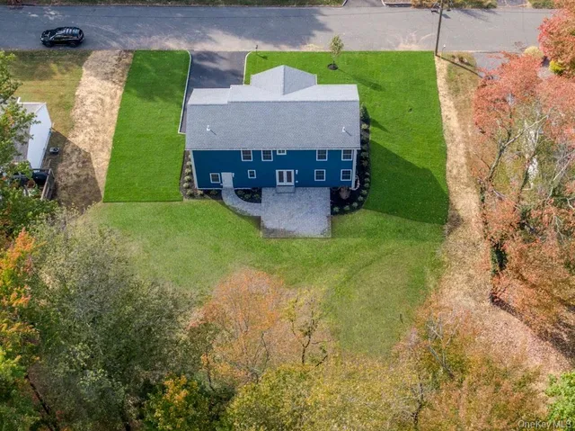 an aerial view of a house with garden