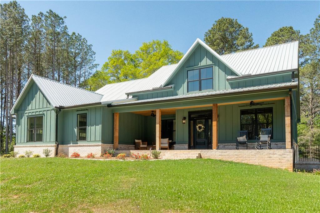 526 Brice Station Road Silver Creek, GA 30173 - Photo 1 of 32 a view of a house with a garden and porch