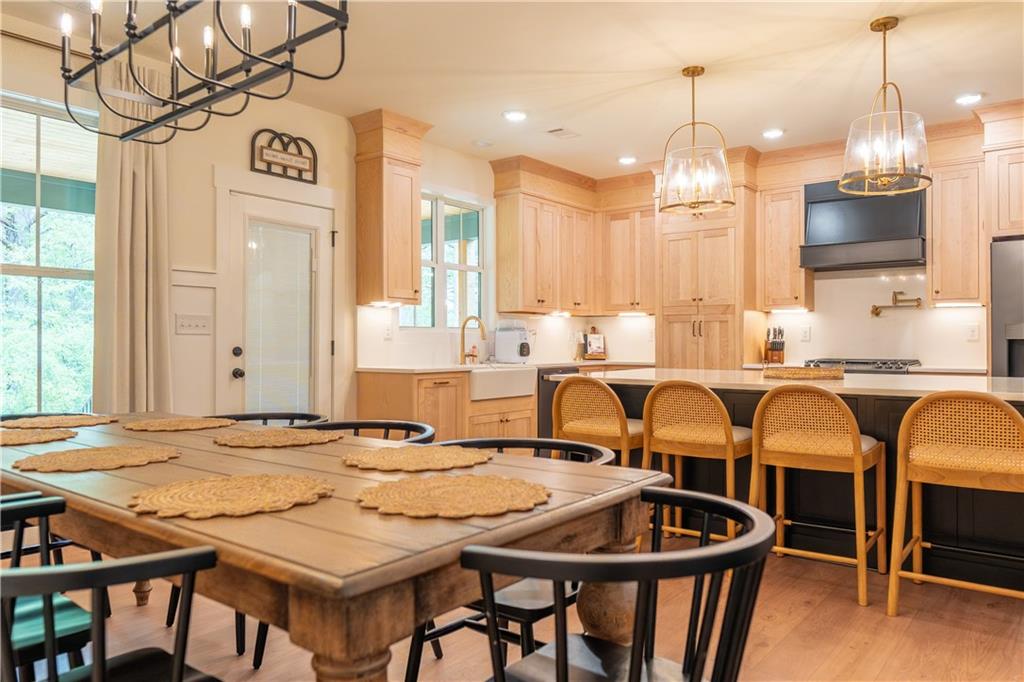 526 Brice Station Road Silver Creek, GA 30173 - Photo 11 of 32 a view of a dining room with furniture and a chandelier