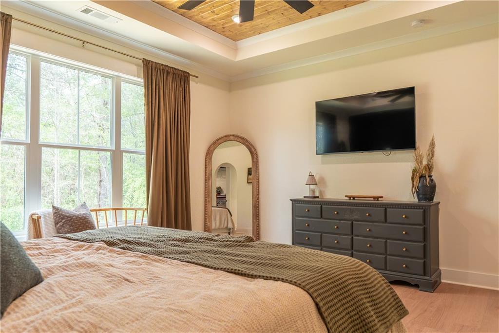 526 Brice Station Road Silver Creek, GA 30173 - Photo 14 of 32 a bedroom with a bed and a flat screen tv