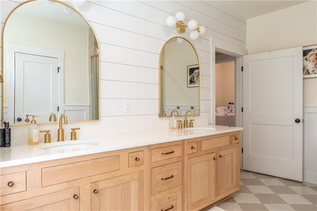 526 Brice Station Road Silver Creek, GA 30173 - Photo 18 of 32 a bathroom with a double vanity sink mirror and