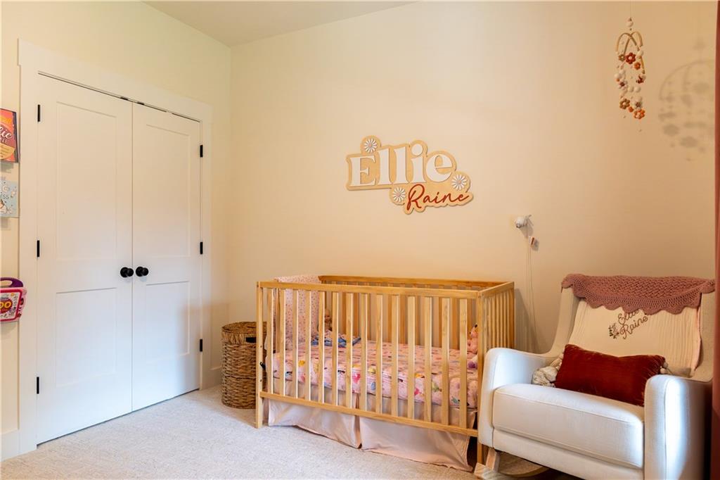 526 Brice Station Road Silver Creek, GA 30173 - Photo 20 of 32 a bedroom with a bed and a chair