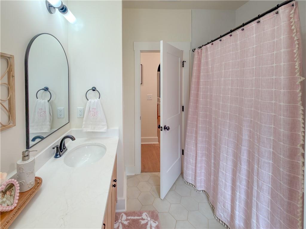 526 Brice Station Road Silver Creek, GA 30173 - Photo 27 of 32 a bathroom with a sink and a mirror