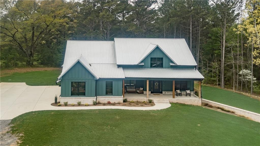 526 Brice Station Road Silver Creek, GA 30173 - Photo 4 of 32 a front view of a house with swimming pool yard and patio