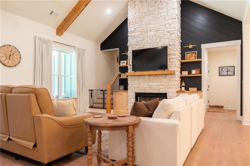 526 Brice Station Road Silver Creek, GA 30173 - Photo 6 of 32 a living room with furniture a flat screen tv and a fireplace