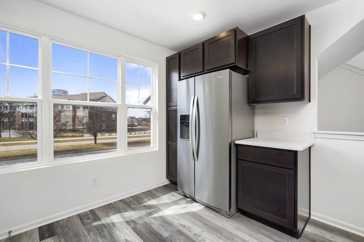 17325 Roscommon Road Tinley Park, IL 60477 - Photo 25 of 37 a kitchen with a refrigerator and a sink