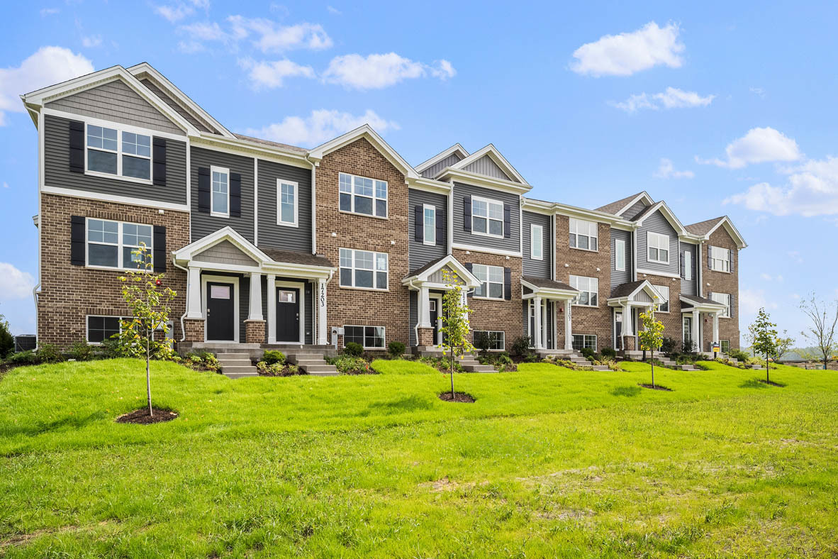 17325 Roscommon Road Tinley Park, IL 60477 - Photo 37 of 37 a front view of a building with yard and green space