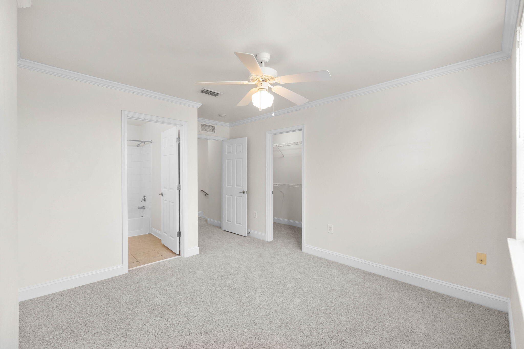 554 Wingspan Way Crestview, FL 32536 - Photo 11 of 20 an empty room with closet and a ceiling fan