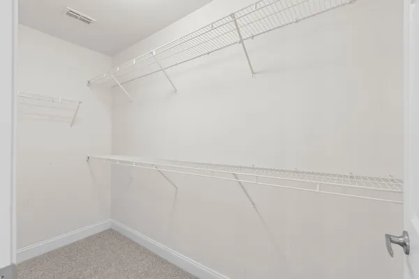 a view of a room with racks on the wall