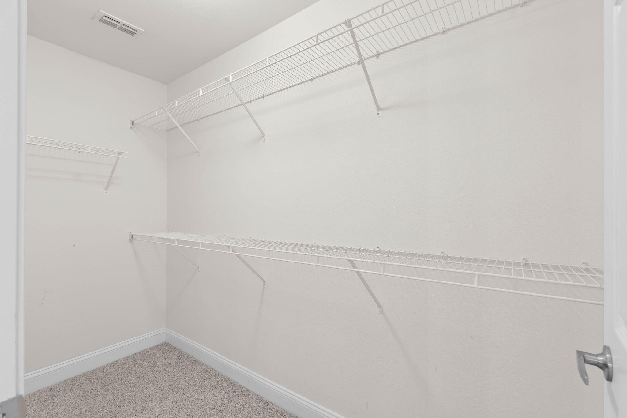 554 Wingspan Way Crestview, FL 32536 - Photo 13 of 20 a view of a room with racks on the wall