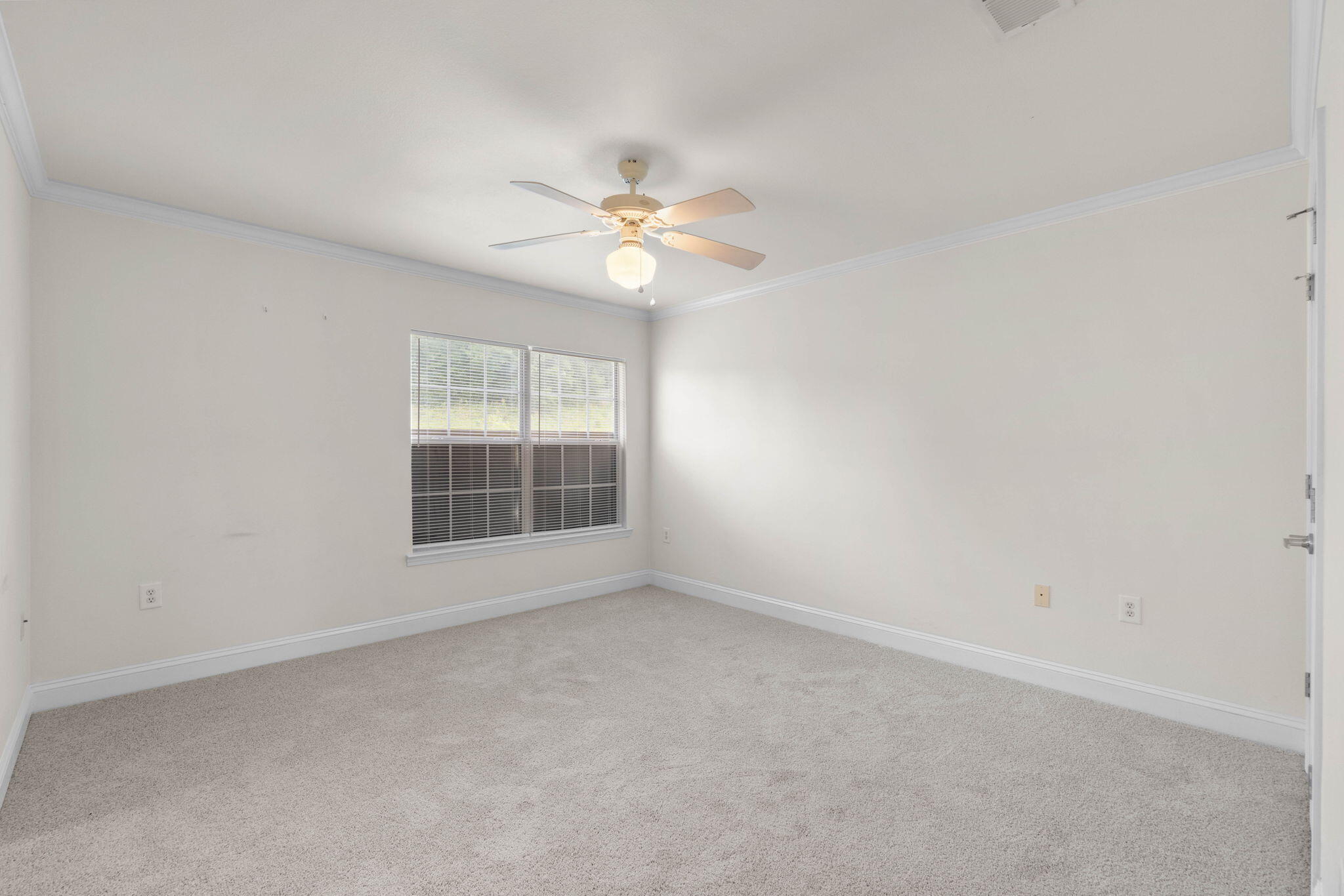 554 Wingspan Way Crestview, FL 32536 - Photo 14 of 20 a view of an empty room with a window