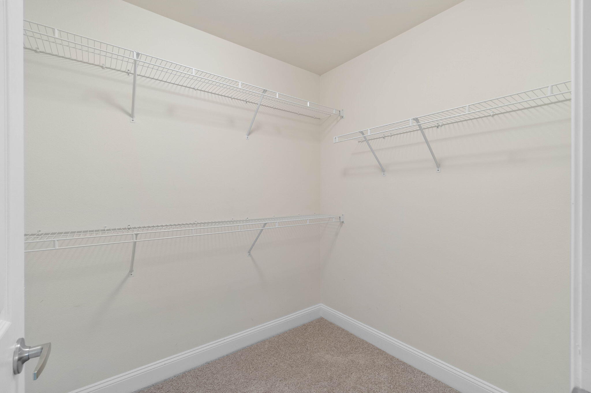 554 Wingspan Way Crestview, FL 32536 - Photo 16 of 20 a view of a room with racks on the wall