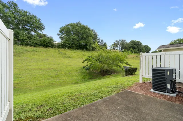 a view of a garden with an outdoor space and seating area