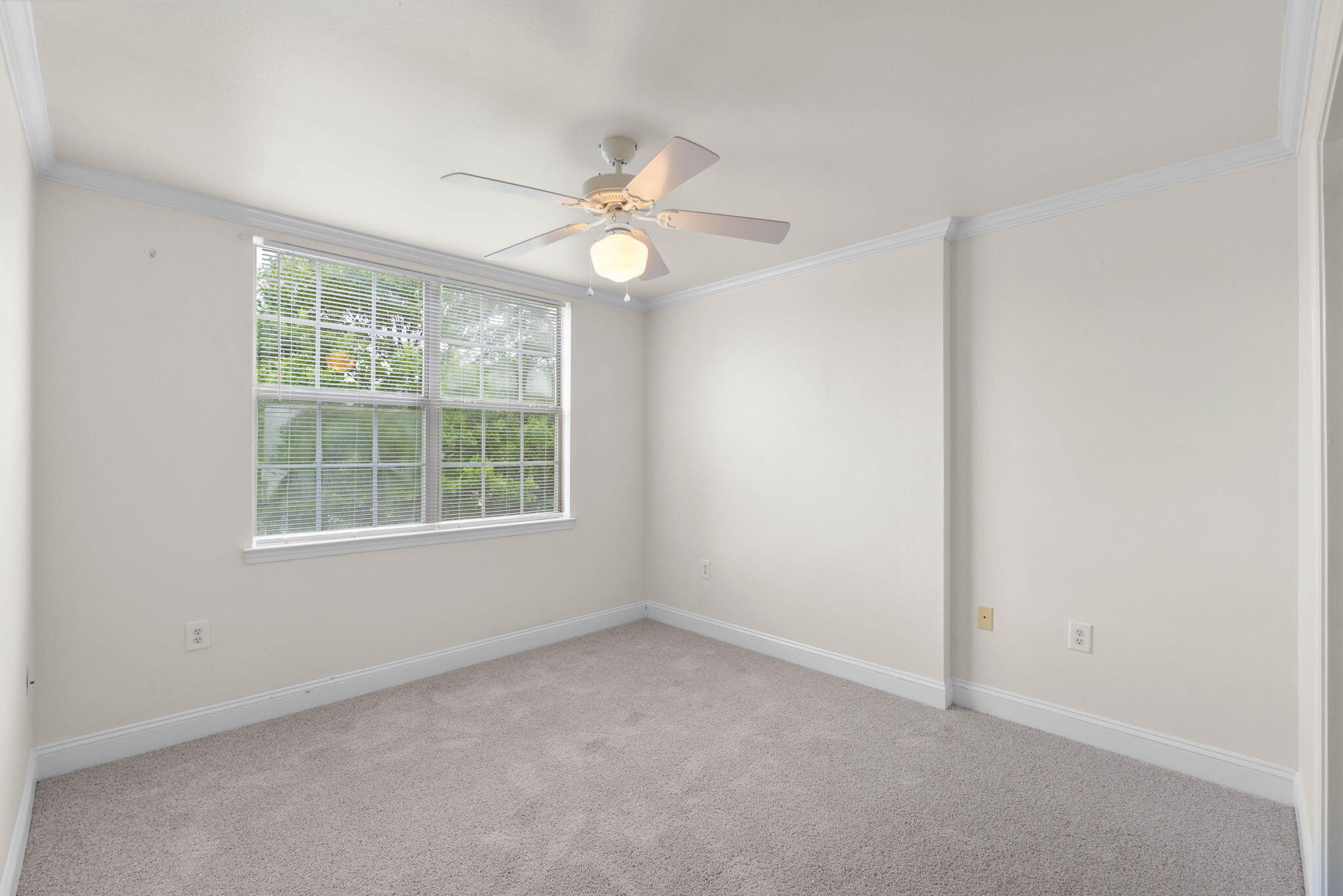 554 Wingspan Way Crestview, FL 32536 - Photo 10 of 20 an empty room with a window and a fan