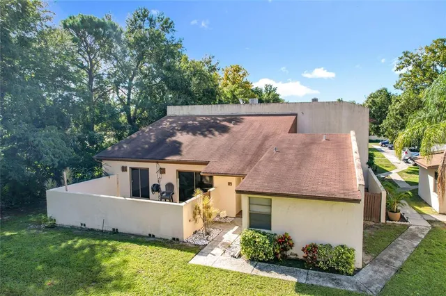 an aerial view of a house with a garden
