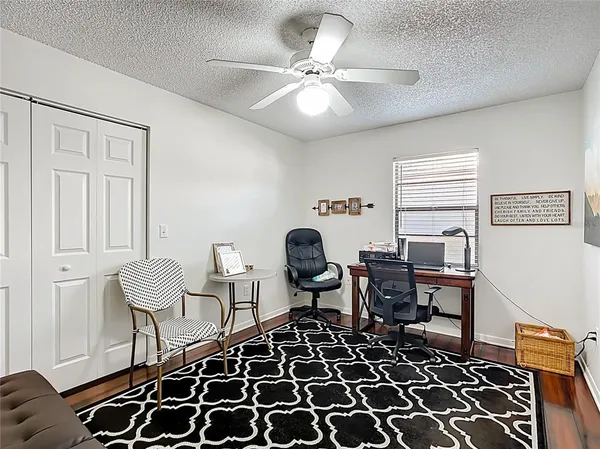 a living room with furniture and a rug