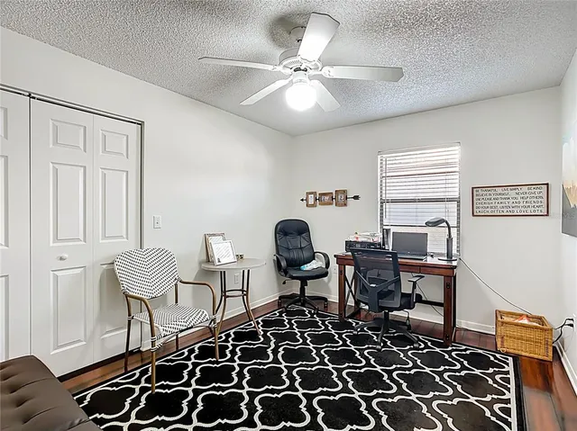 a living room with furniture and a rug