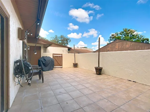a view of a house with a yard and plants