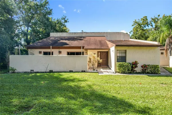 an aerial view of residential houses with outdoor space and street view