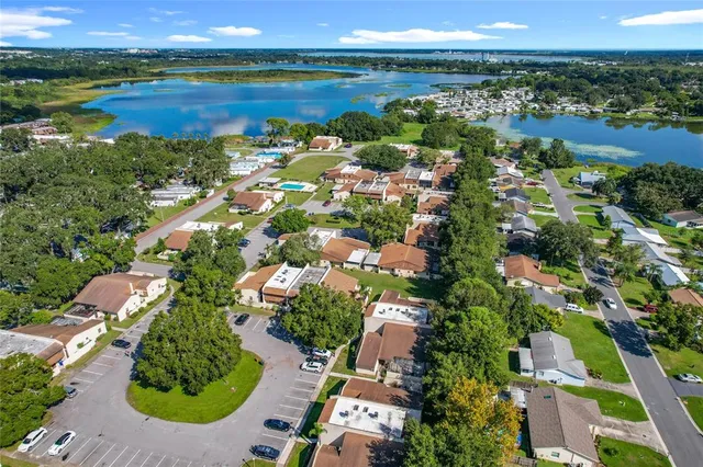 an aerial view of residential houses with outdoor space and parking space