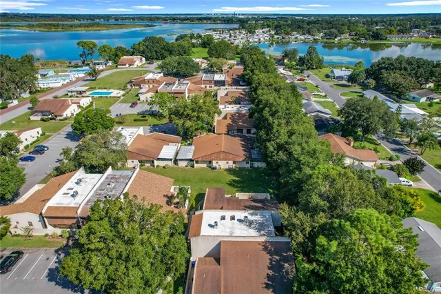 an aerial view of a house with yard swimming pool and outdoor seating