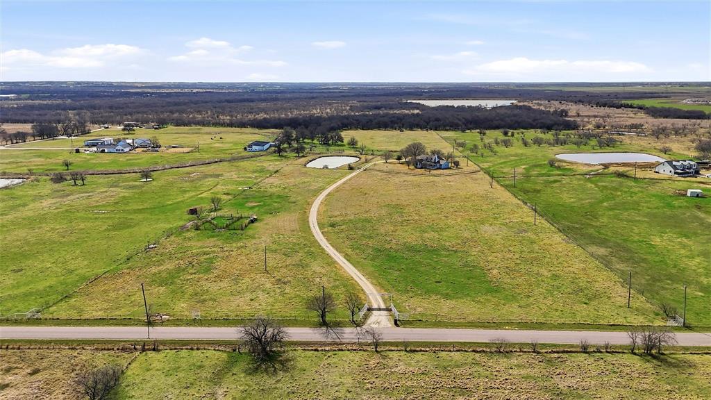 206 Bounds Ranch Road Gunter, TX 75058 - Photo 2 of 29 a view of a swimming pool with a table and chairs