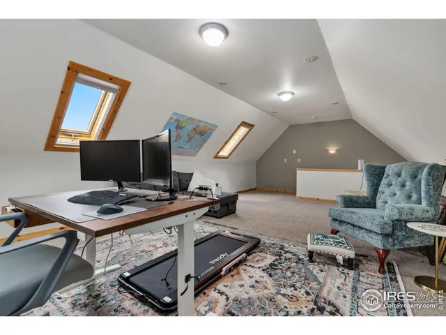 a view of a workspace with furniture