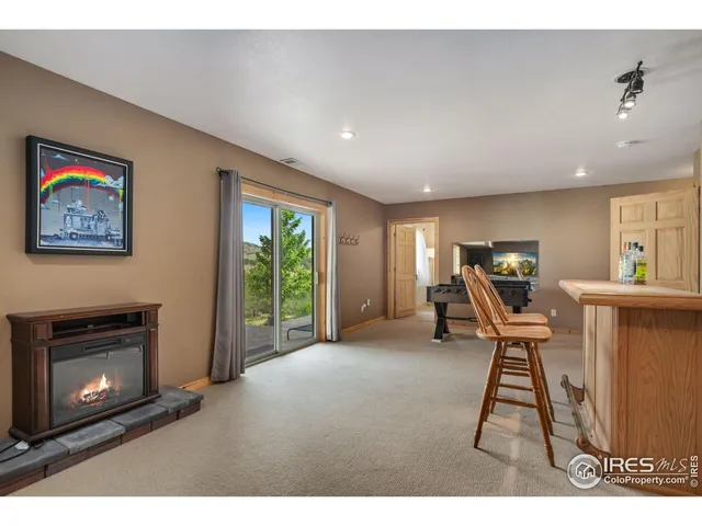 a workspace with furniture a fireplace and a window
