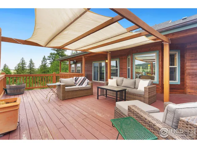 a balcony with furniture and a potted plant