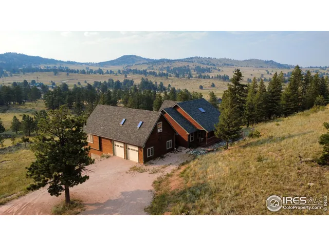 a view of house with mountain view