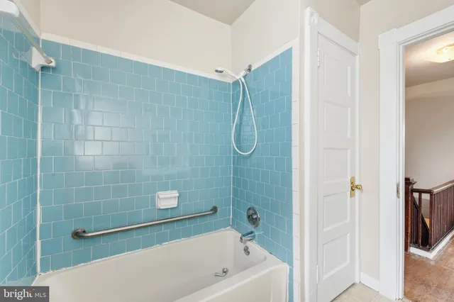 a bathroom with a shower and a bathtub