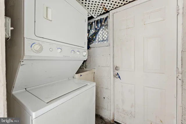 an empty room with a empty space and windows