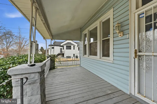 a view of a house with wooden deck
