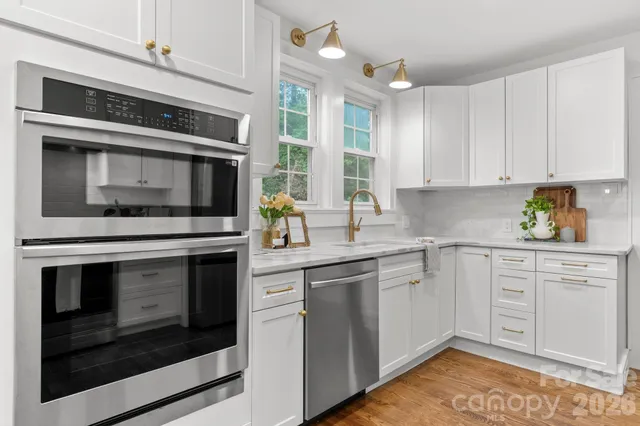 a dining room with furniture window and wooden floor