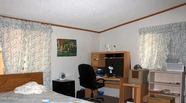 a work room with furniture and a window