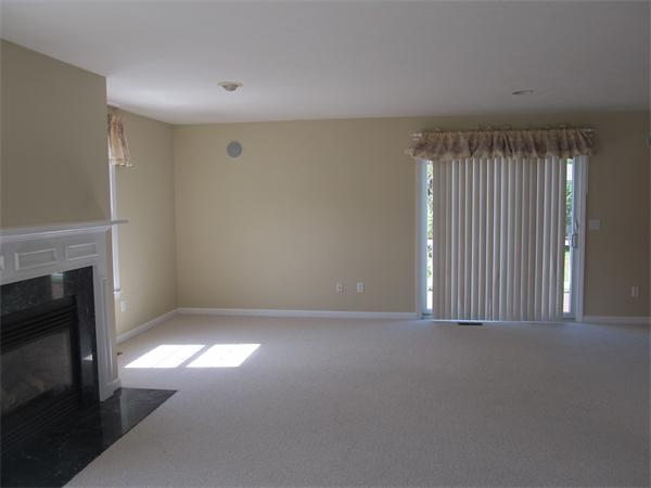 64 Clark Road Shirley, MA 01464 - Photo 11 of 25 a view of an empty room with a fireplace