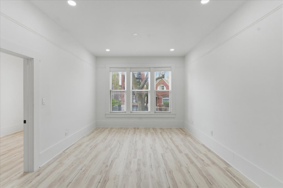 2607 West Haddon Avenue, Unit 2F Chicago, IL 60622 - Photo 7 of 12 wooden floor in an empty room with a window